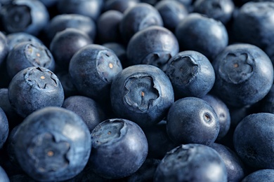 Photo of Fresh raw blueberries as background, closeup view