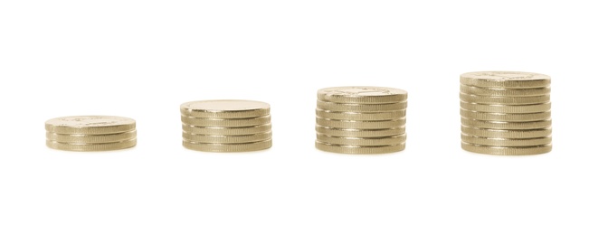 Photo of Stacked coins on white background. Investment concept