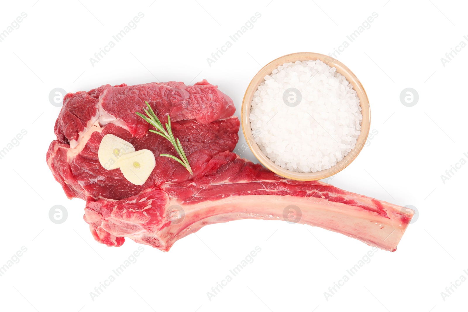 Photo of Raw ribeye steak and spices isolated on white, top view