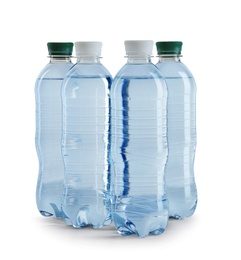 Set of different plastic bottles with water on white background