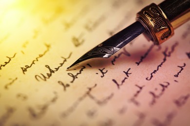 Writing letter with fountain pen, closeup view