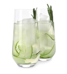 Photo of Glasses of refreshing cucumber lemonade and rosemary on white background. Summer drink