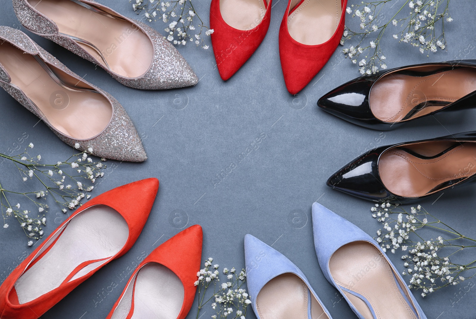 Photo of Flat lay composition with stylish female shoes on grey background. Space for text