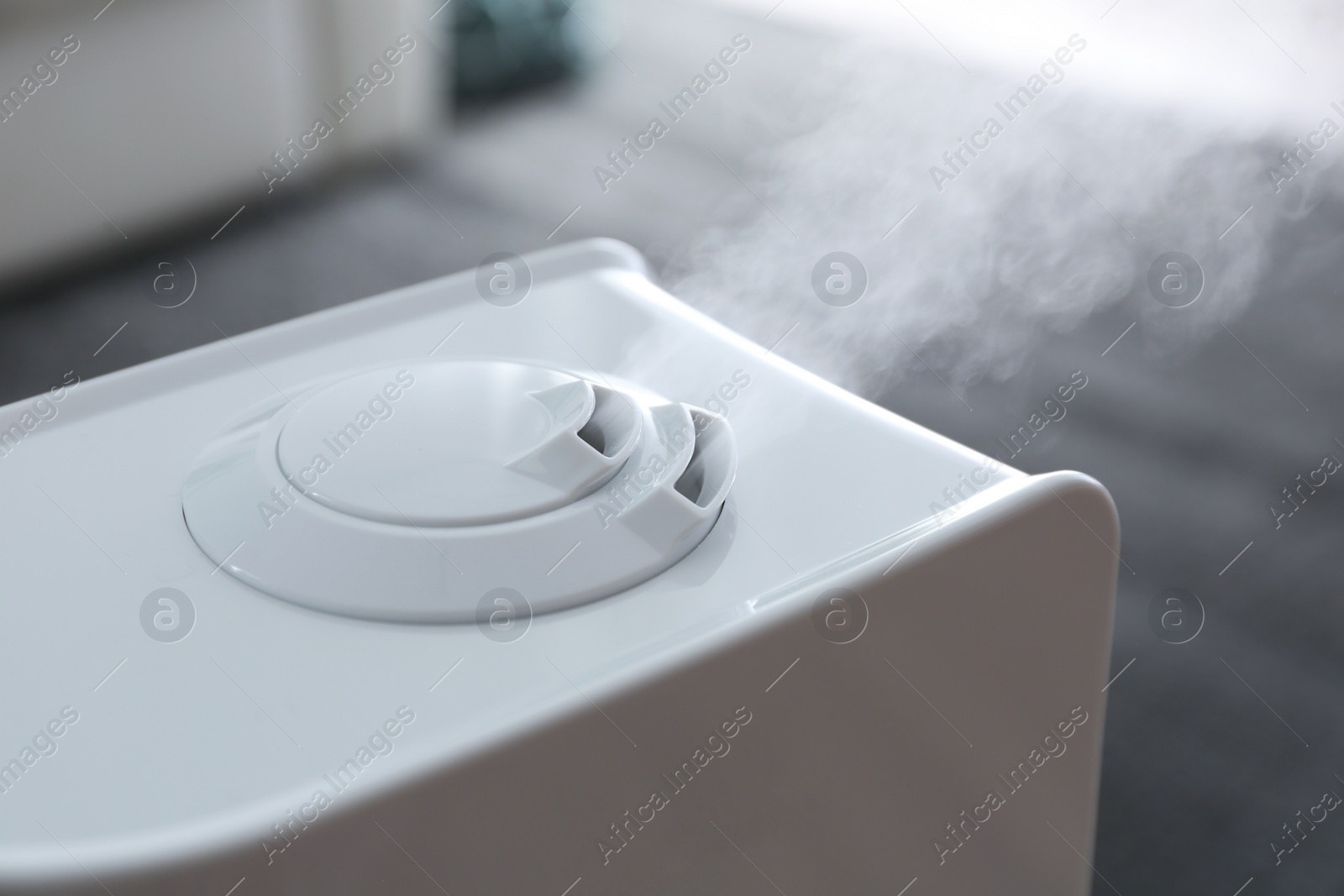 Photo of Modern air humidifier at home, closeup view