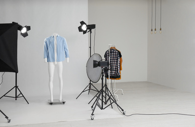 Photo of Ghost mannequin with modern clothes in professional photo studio