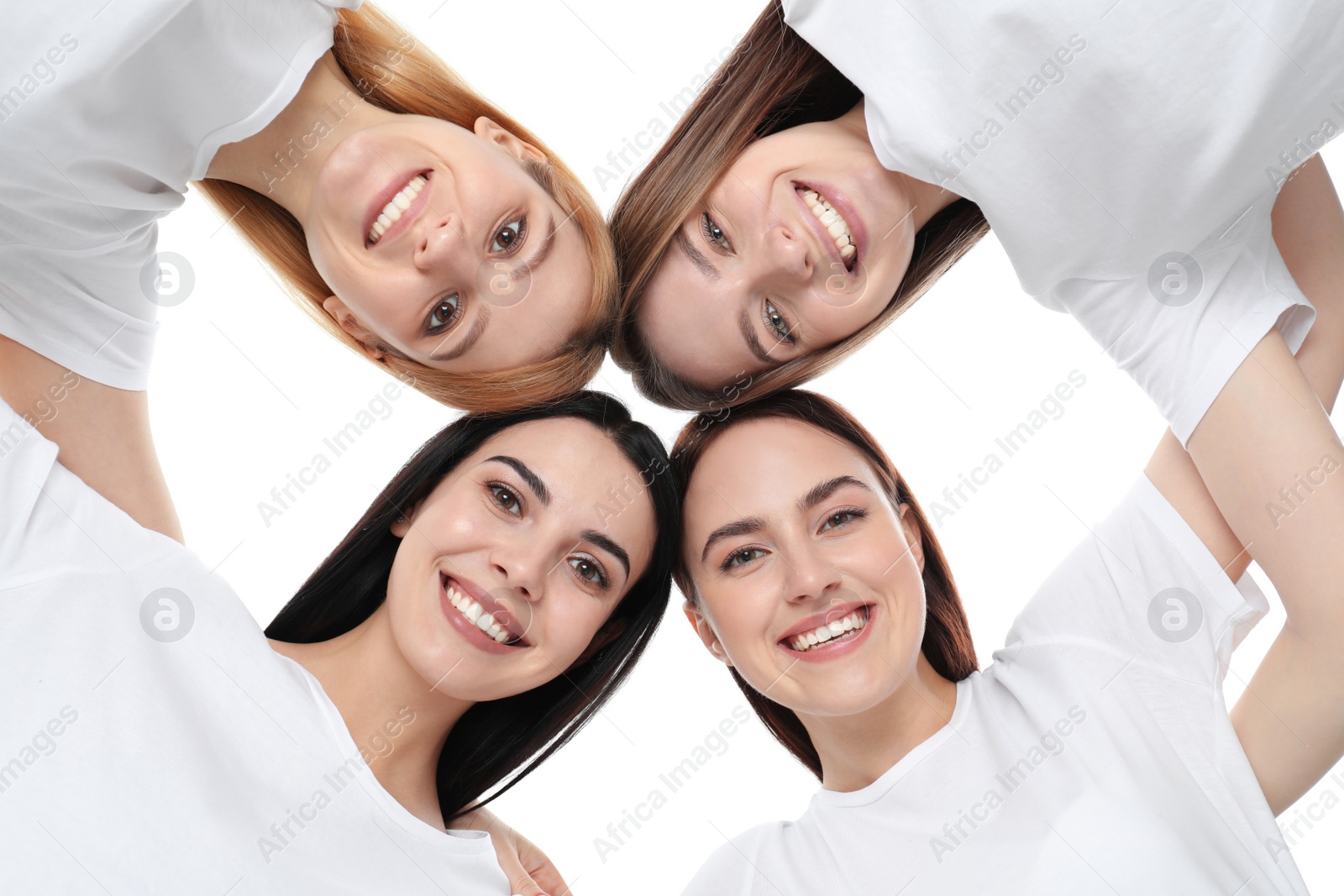 Photo of Beautiful young ladies hugging on white background, bottom view. Women's Day