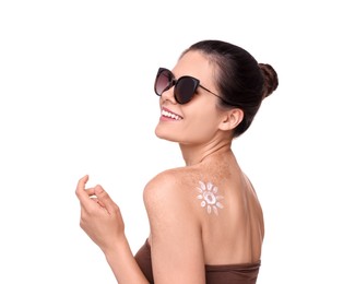 Beautiful young woman in sunglasses with sun protection cream on her back against white background