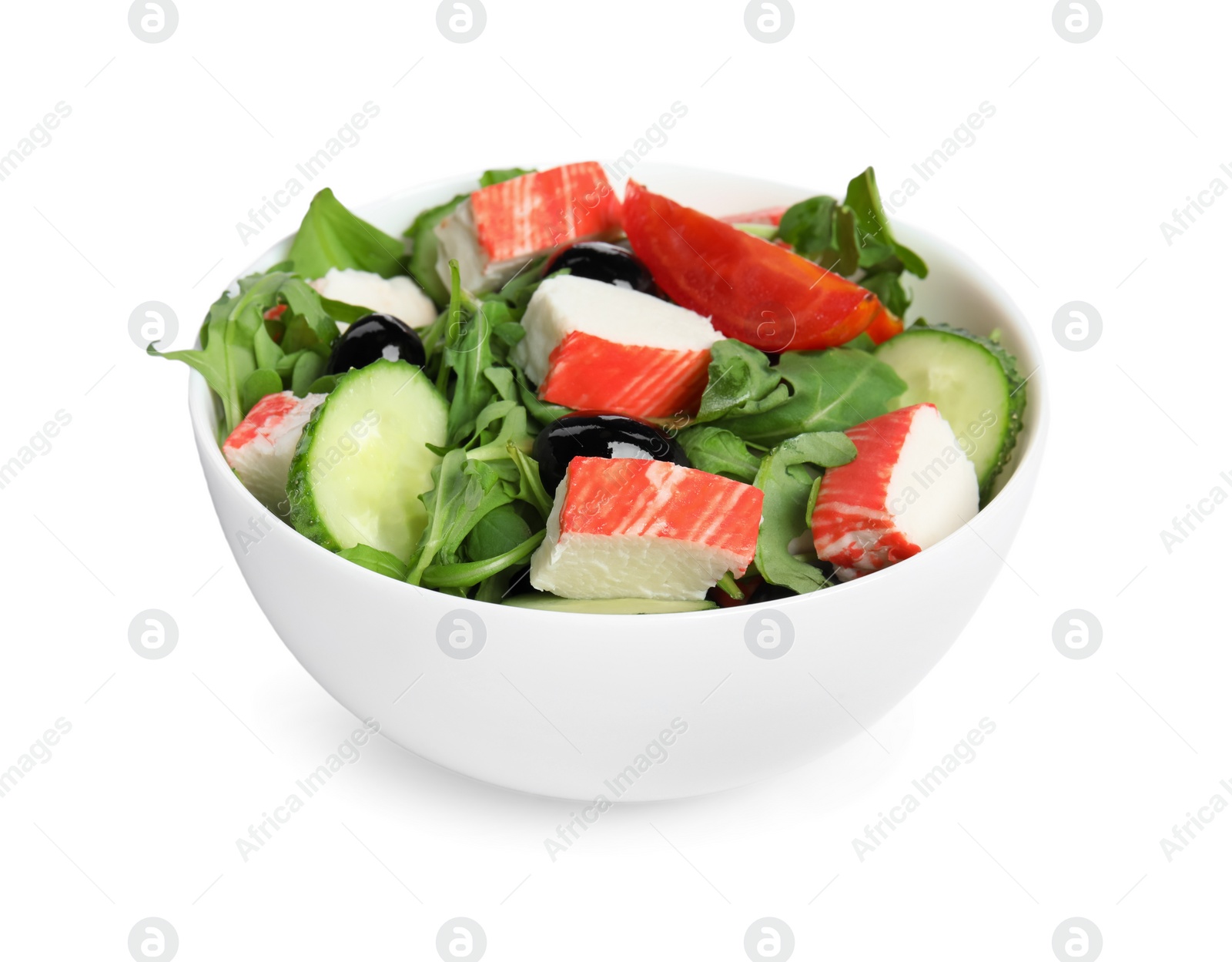 Photo of Tasty crab stick salad in bowl isolated on white