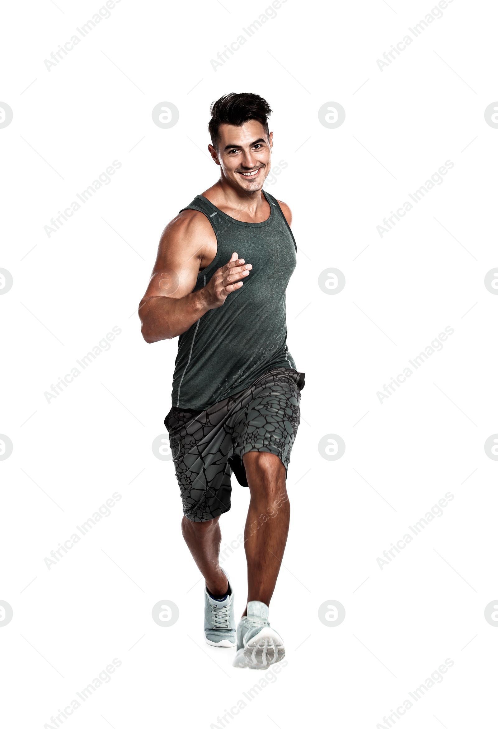 Photo of Handsome young man running on white background