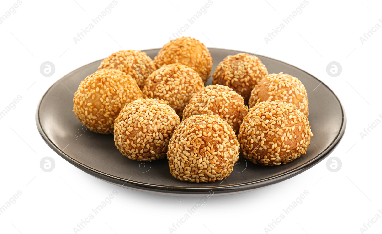 Photo of Plate of delicious sesame balls on white background