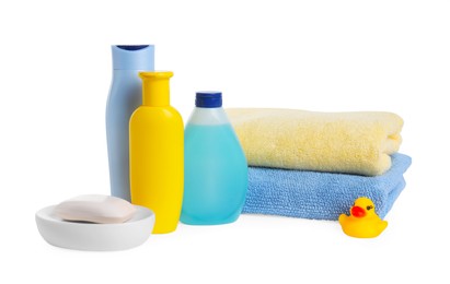 Baby cosmetic products, bath duck and towels isolated on white