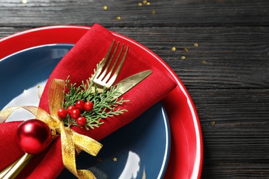 Photo of Beautiful Christmas table setting on wooden background, closeup