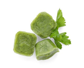 Photo of Frozen broccoli puree cubes isolated on white, top view