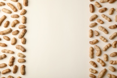 Photo of Composition with peanuts and space for text on color background, top view