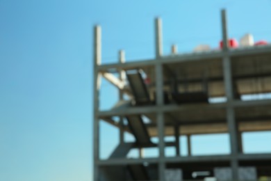 Blurred view of unfinished building against blue sky