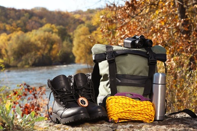 Set of camping equipment on ground outdoors