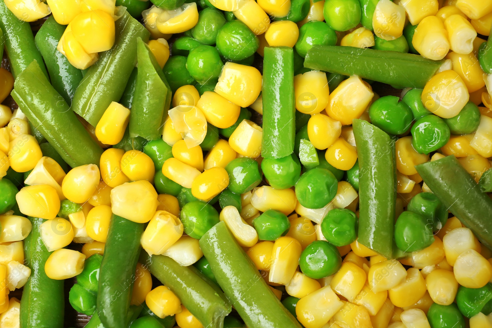 Photo of Mix of frozen vegetables as background, top view