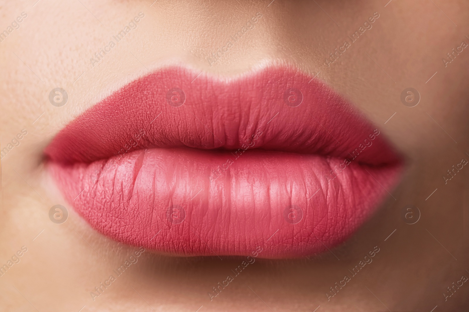 Image of Woman with beautiful perfect lips after permanent makeup procedure, closeup