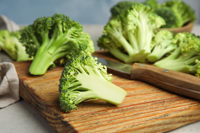 Photo of Fresh green broccoli on light table. Organic food