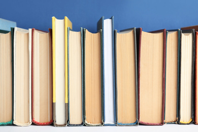 Collection of old books on white shelf