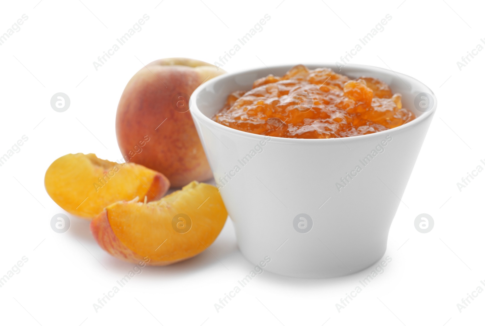 Photo of Bowl with peach jam and fresh fruit on white background