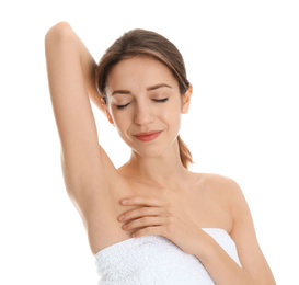 Photo of Young woman showing armpit with smooth clean skin on white background
