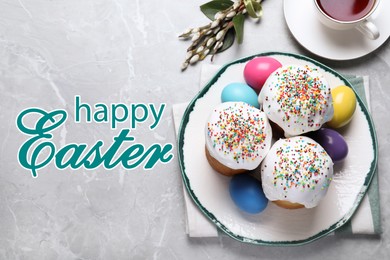 Happy holiday. Traditional Easter cakes and painted eggs on light grey table, flat lay