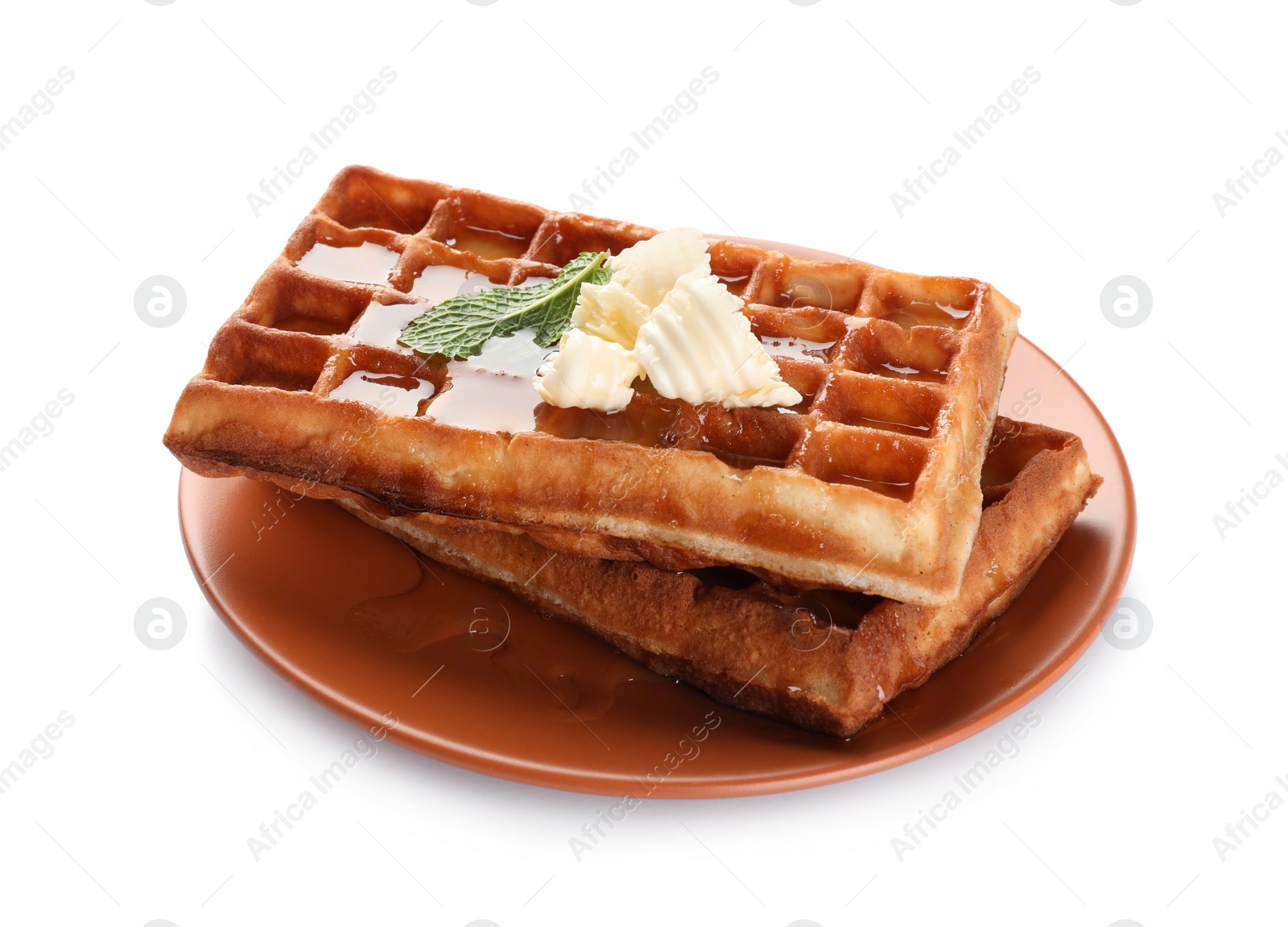 Photo of Delicious Belgian waffles with honey, mint and butter on white background