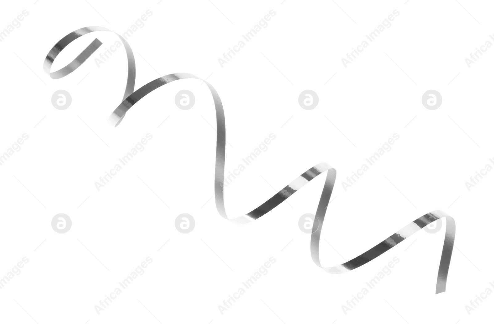 Photo of Shiny serpentine streamer on white background. Festive decor