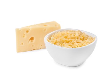 Grated cheese in bowl and piece of one isolated on white