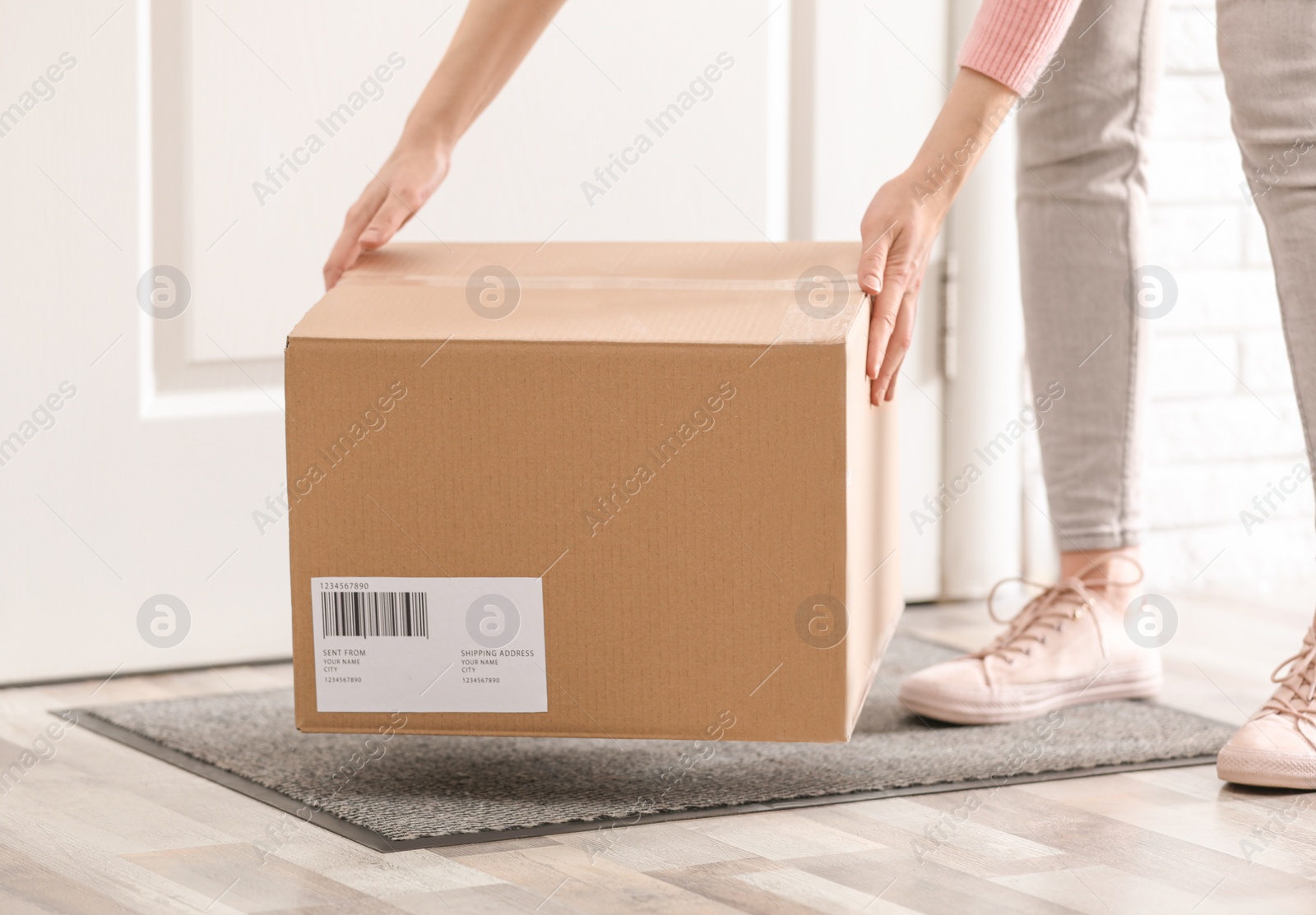 Photo of Woman taking parcel, closeup view. Delivery service