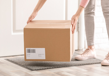 Photo of Woman taking parcel, closeup view. Delivery service