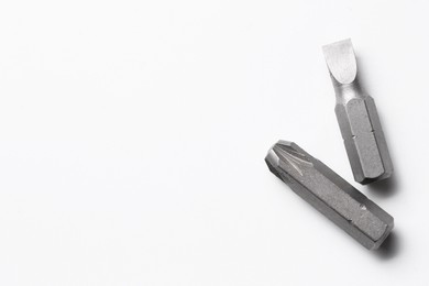 Photo of Different screwdriver bits on white background, top view