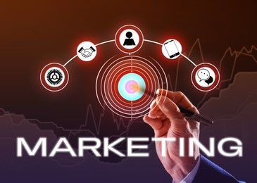 Marketing concept. Businessman pointing at target on digital screen against color background, closeup