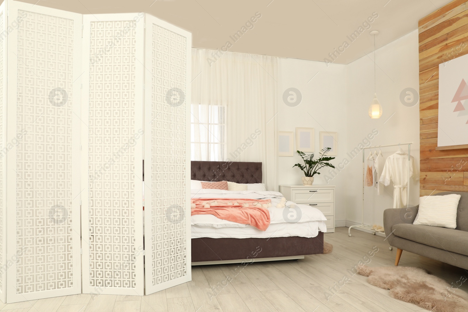 Photo of Modern folding screen in stylish room interior