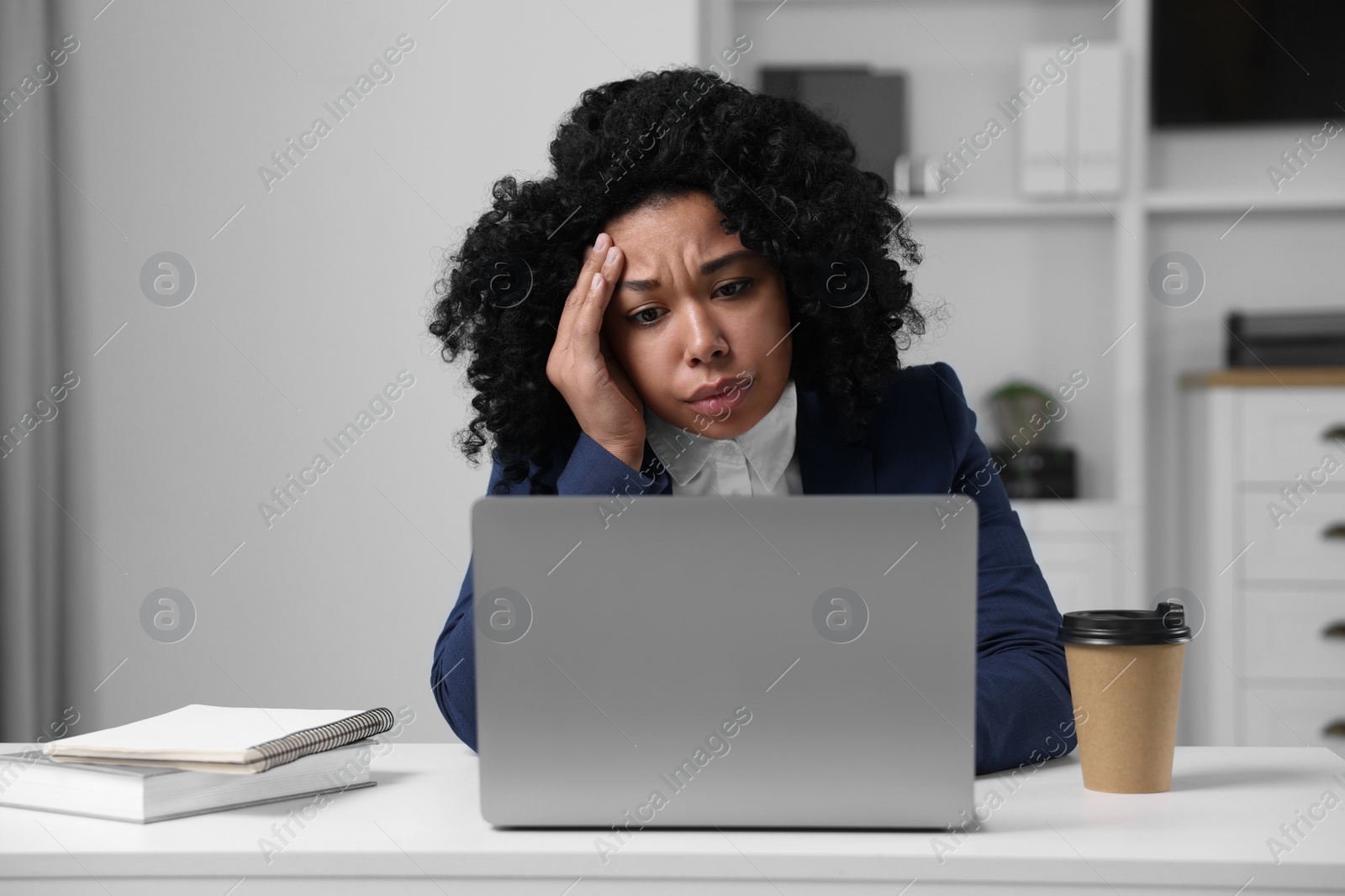 Photo of Deadline concept. Stressed woman working with laptop in office