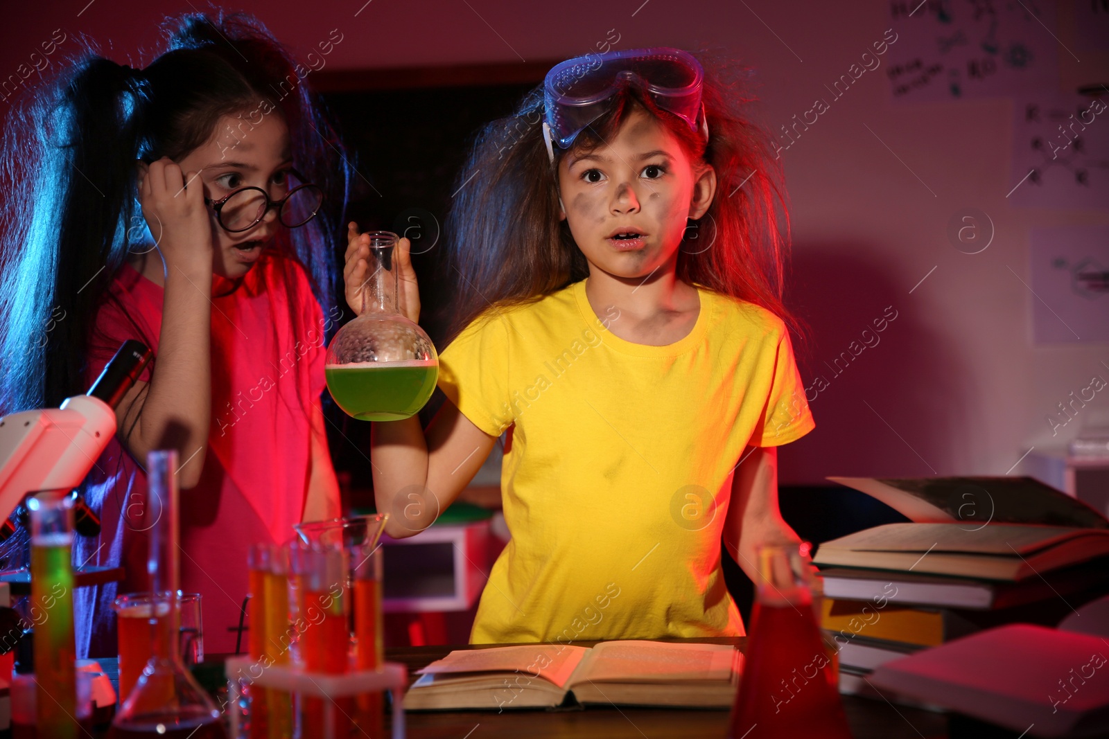 Photo of Children doing chemical research in laboratory. Dangerous experiment