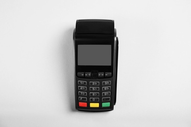 Modern payment terminal on grey background, top view