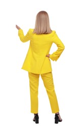 Photo of Businesswoman in suit standing on white background, back view