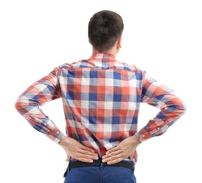 Young man suffering from back pain on white background