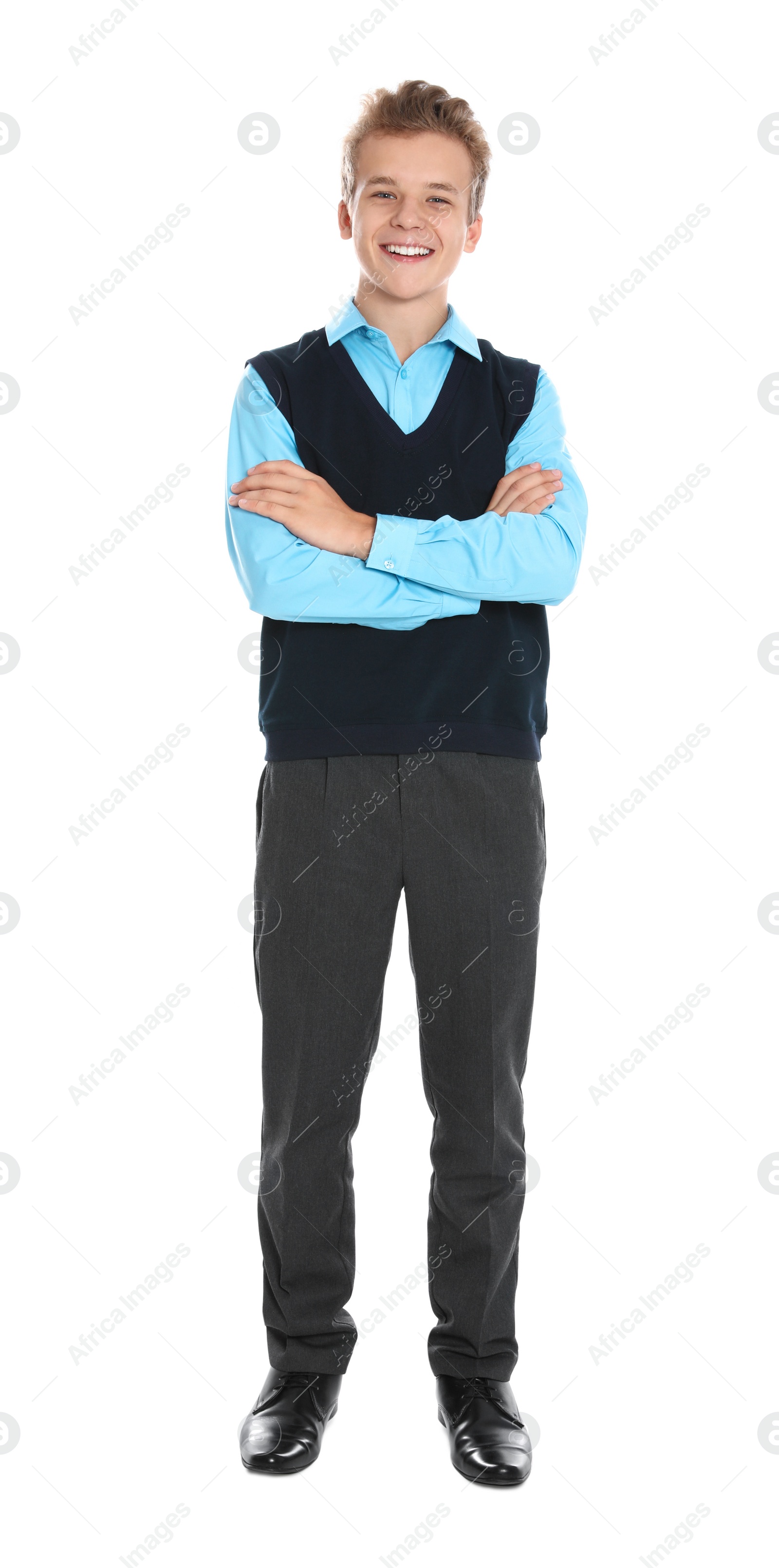 Photo of Happy boy in school uniform on white background