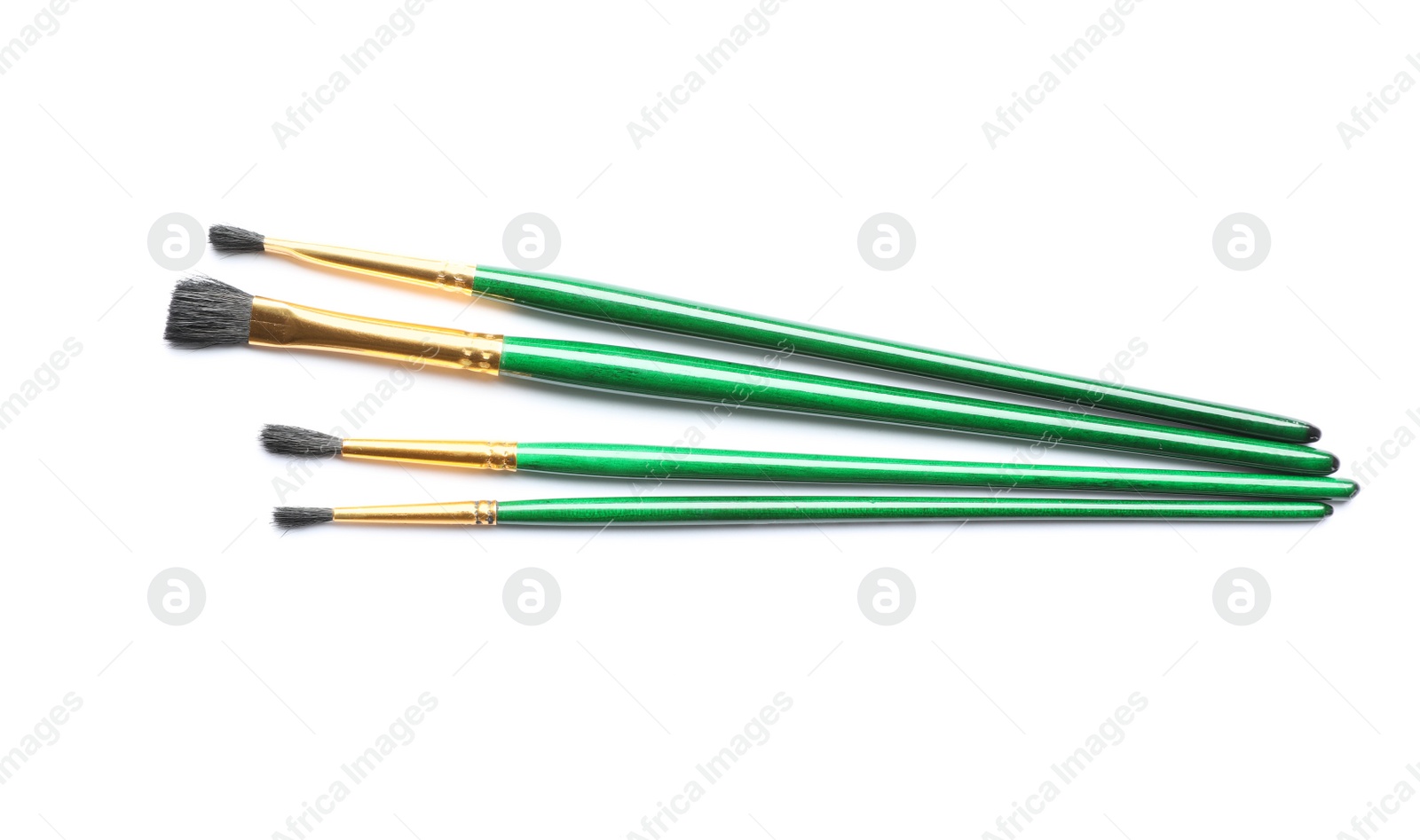 Photo of New brushes on white background, top view. Painting equipment for children