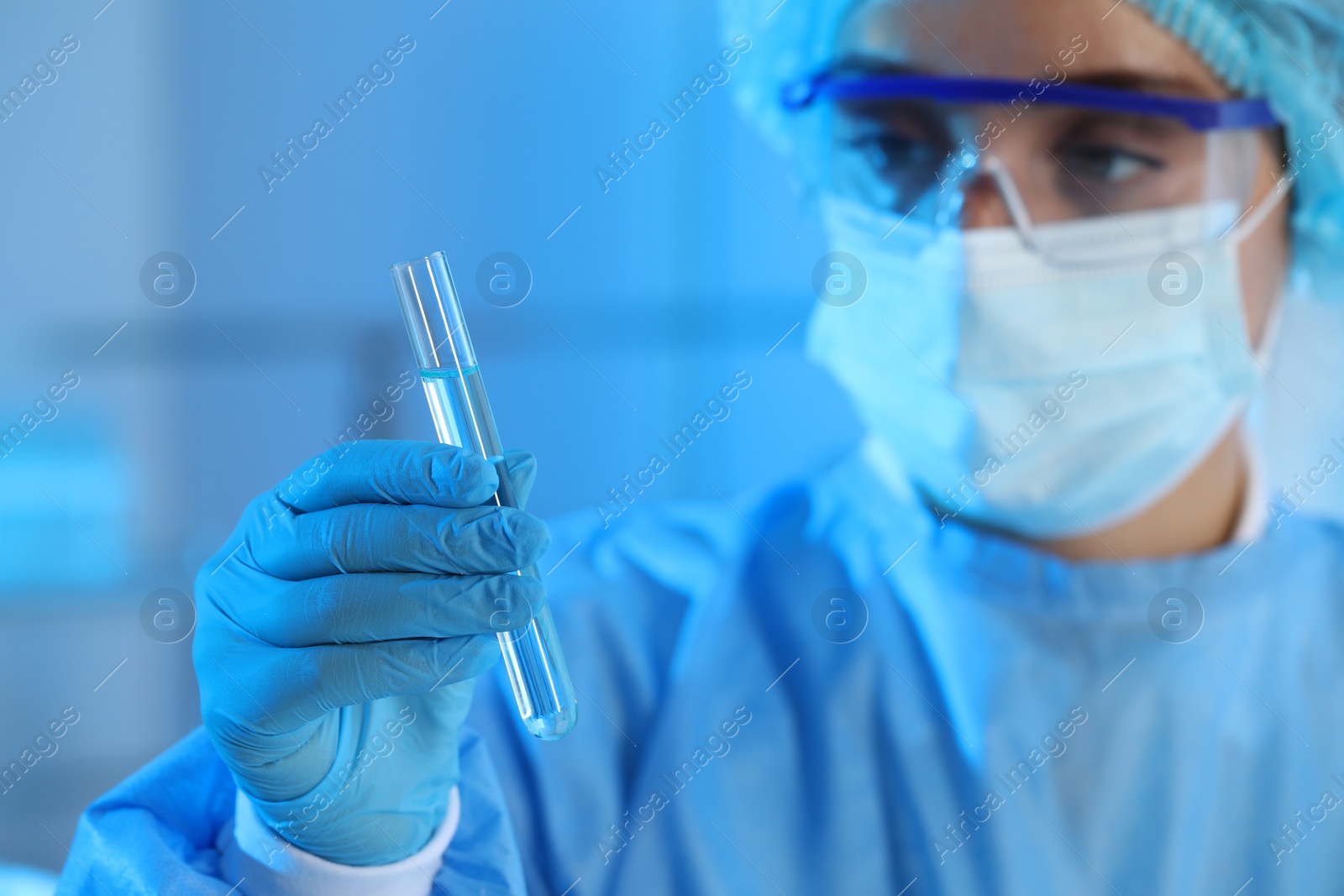 Photo of Scientist working with sample in laboratory, focus on hand. Medical research