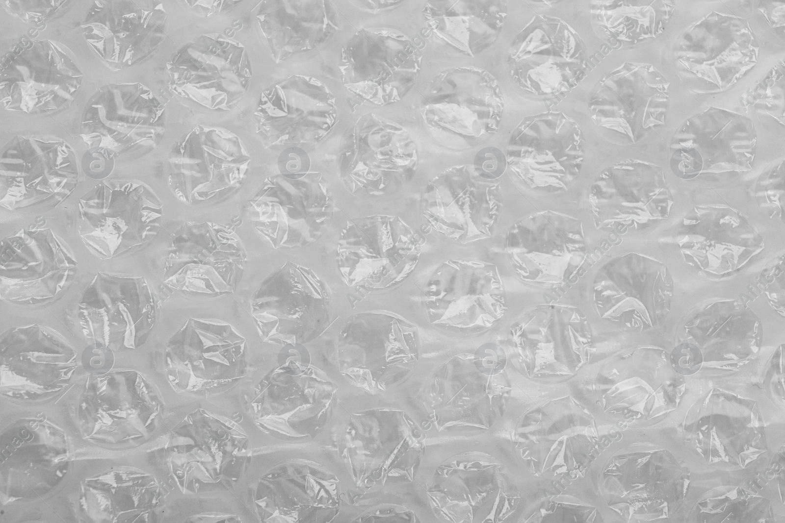 Photo of Texture of bubble wrap as background, top view