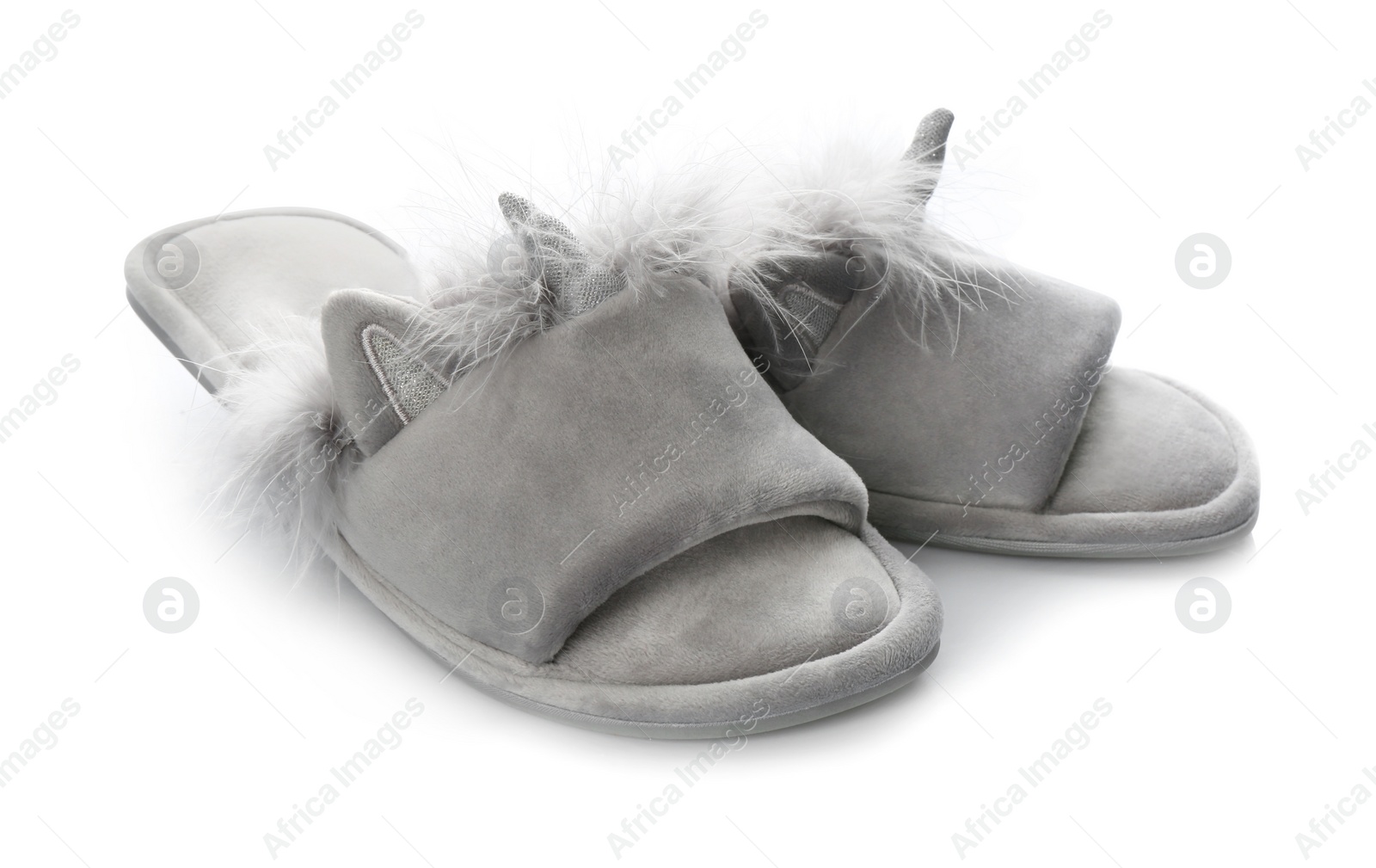 Photo of Pair of stylish soft slippers on white background