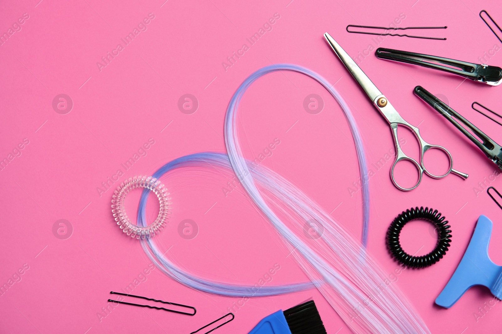 Photo of Flat lay composition with hair salon tools on color background