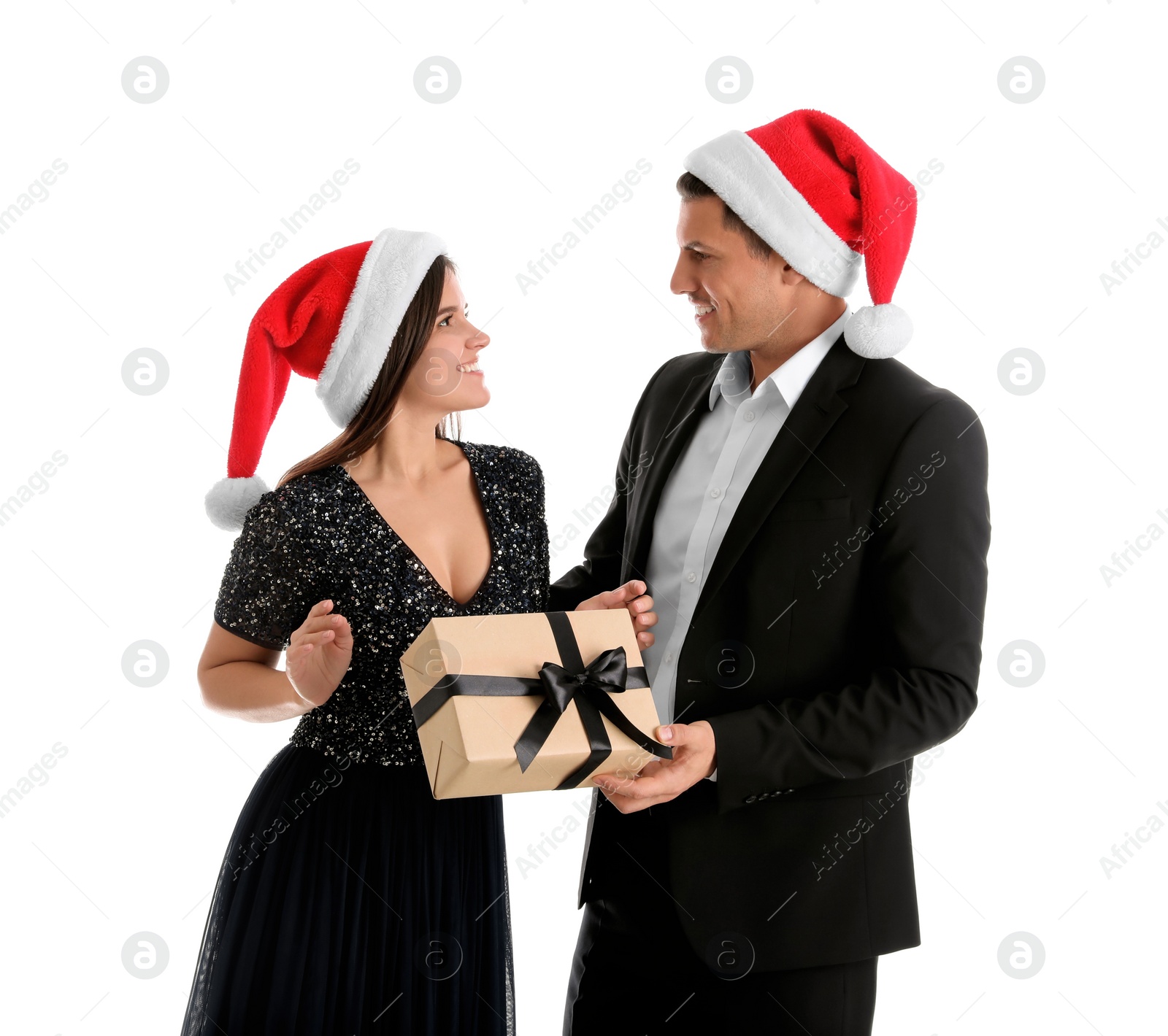 Photo of Man presenting Christmas gift to his girlfriend on white background