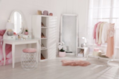 Photo of Blurred view of stylish dressing room. Interior design