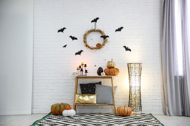 Photo of Modern room decorated for Halloween. Idea for festive interior