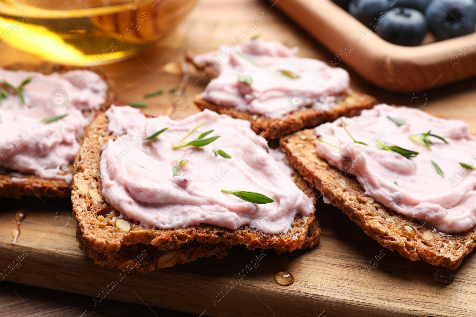 Photo of Tasty sandwiches with cream cheese and thyme, closeup